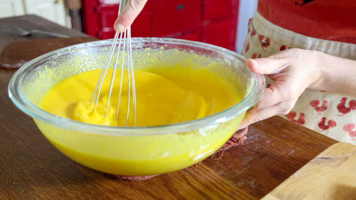 stirring dutch baby batter with whisk