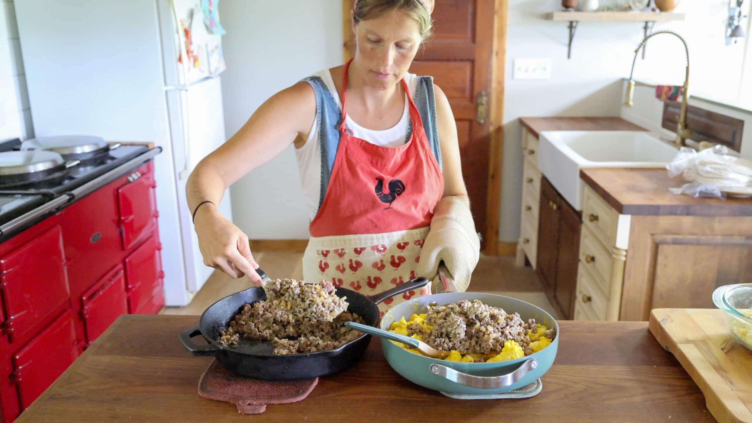 adding breakfasat sausage to eggs