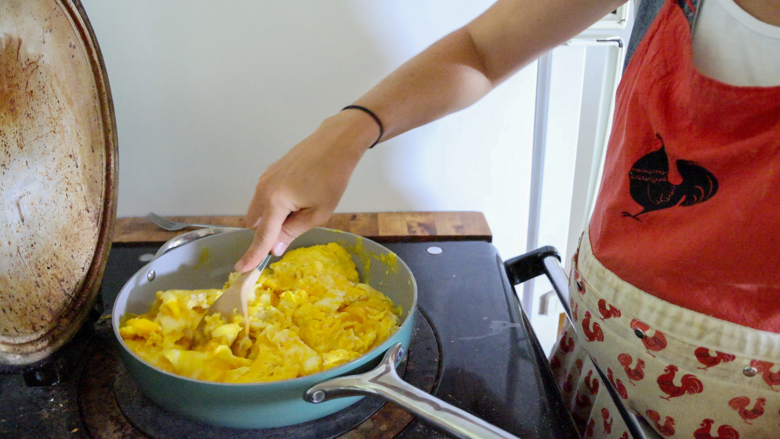 making scrambled eggs for breakfast burritos