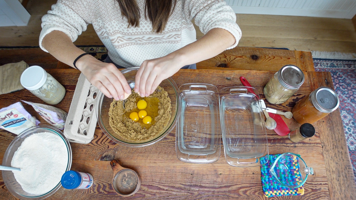 adding eggs to applesauce bread