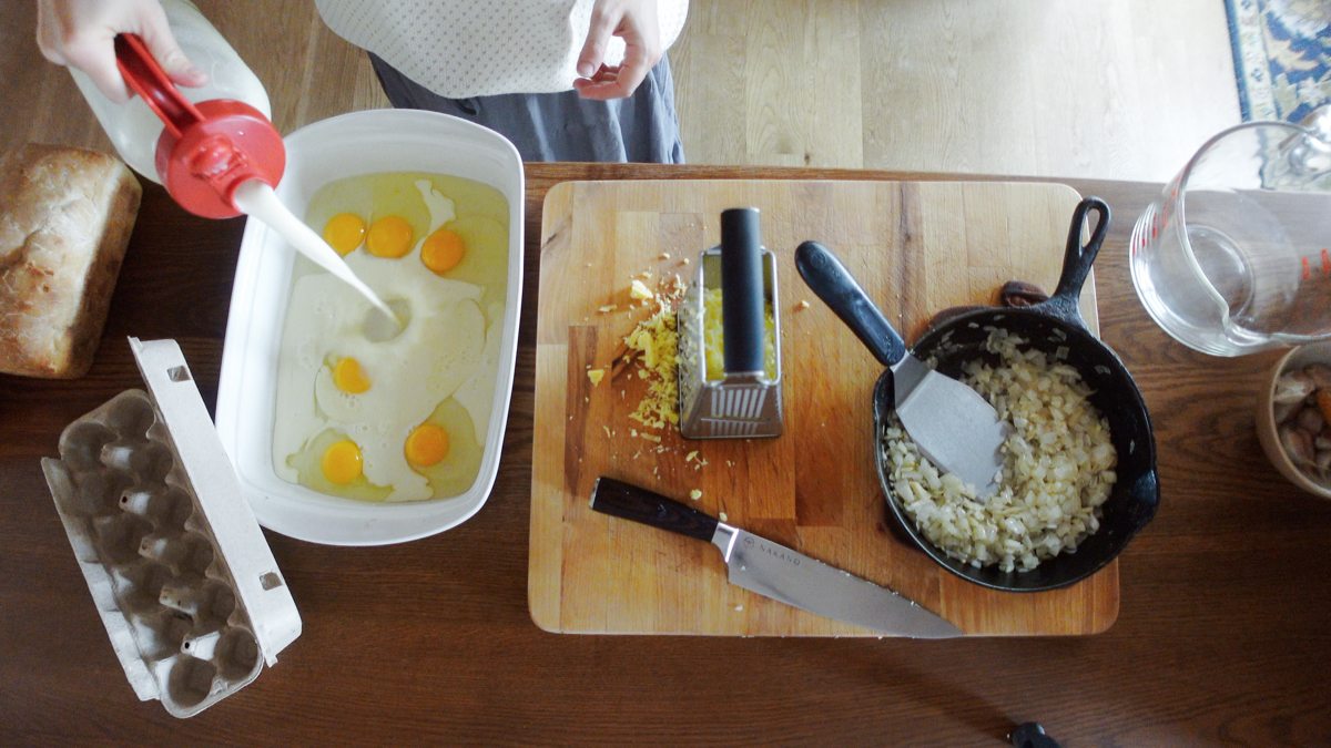 adding milk for ham and cheese strata