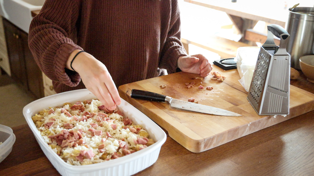 topping strata with diced ham