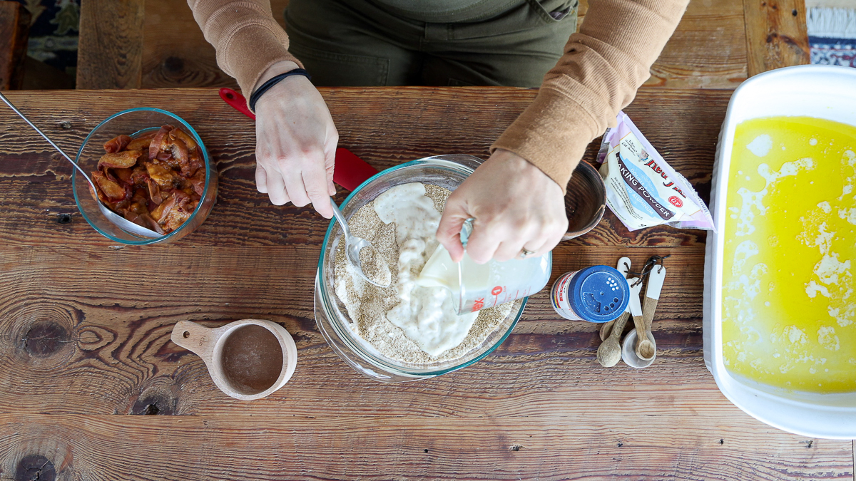 adding milk to easy peach cobbler recipe