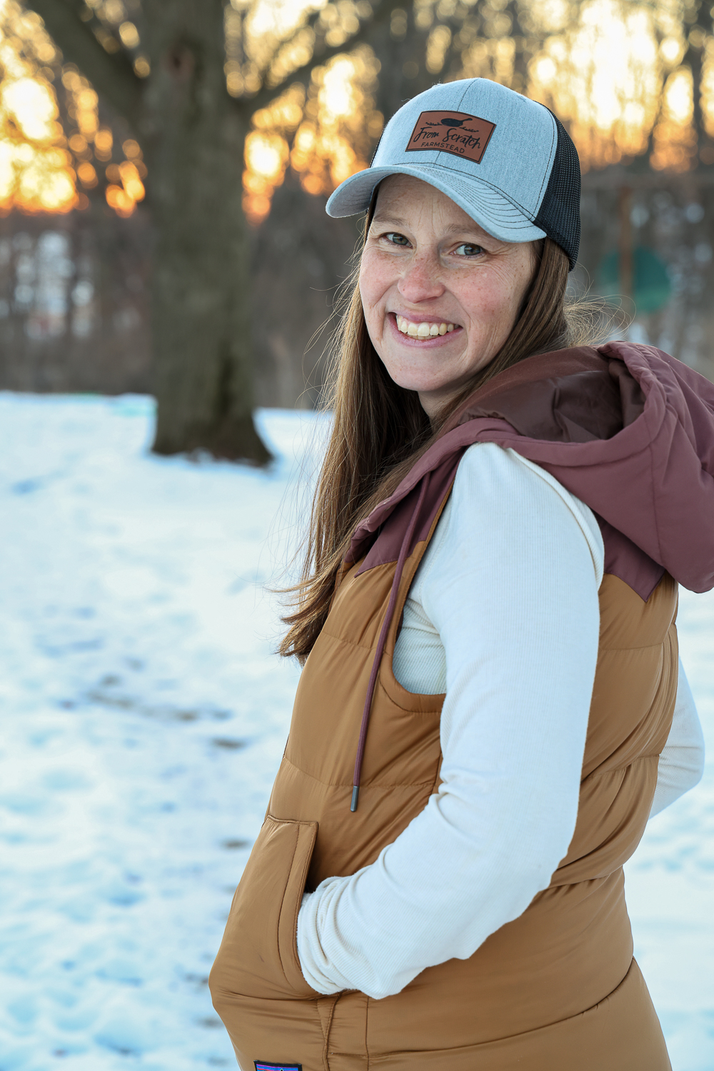 homesteader wearing from scratch farmstead hat