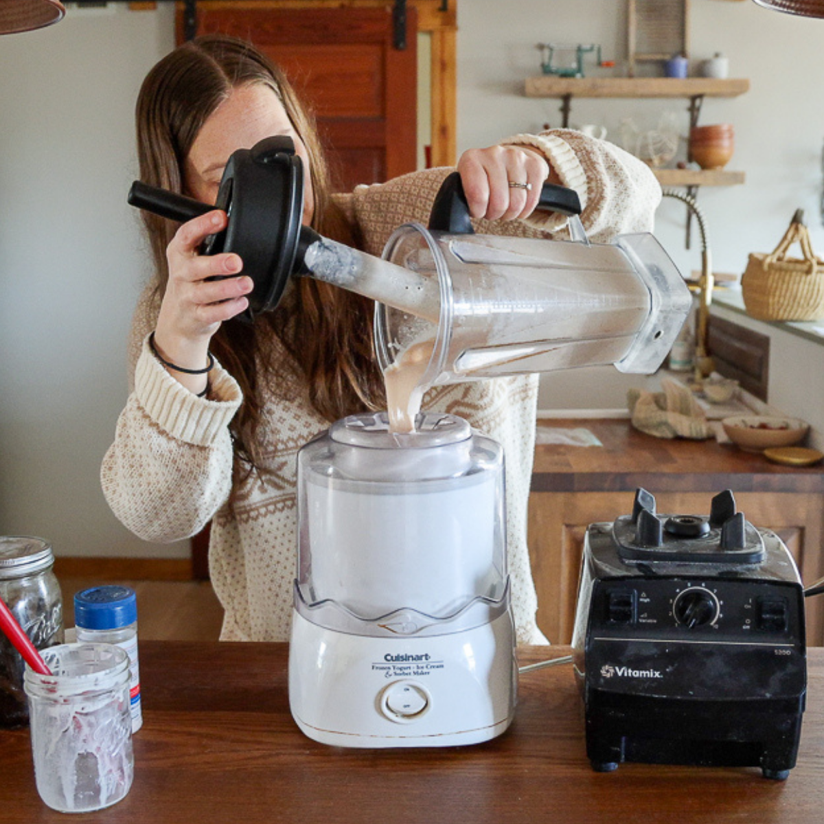pouring peach ice cream mixture into ice cream maker
