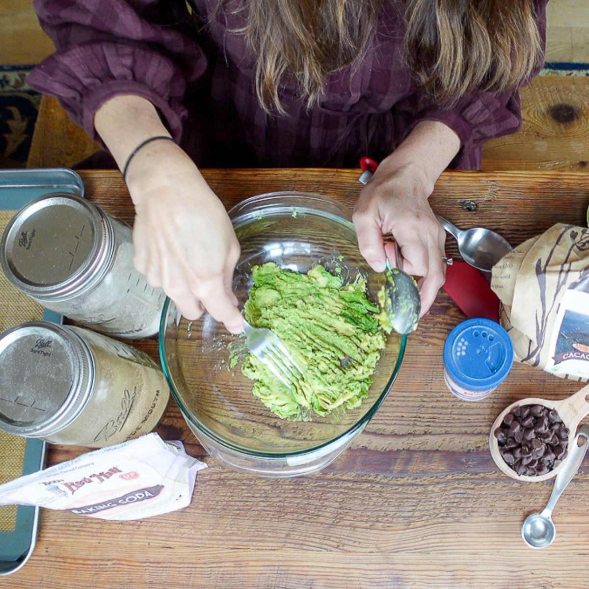 mashing avocados for avocado cookies