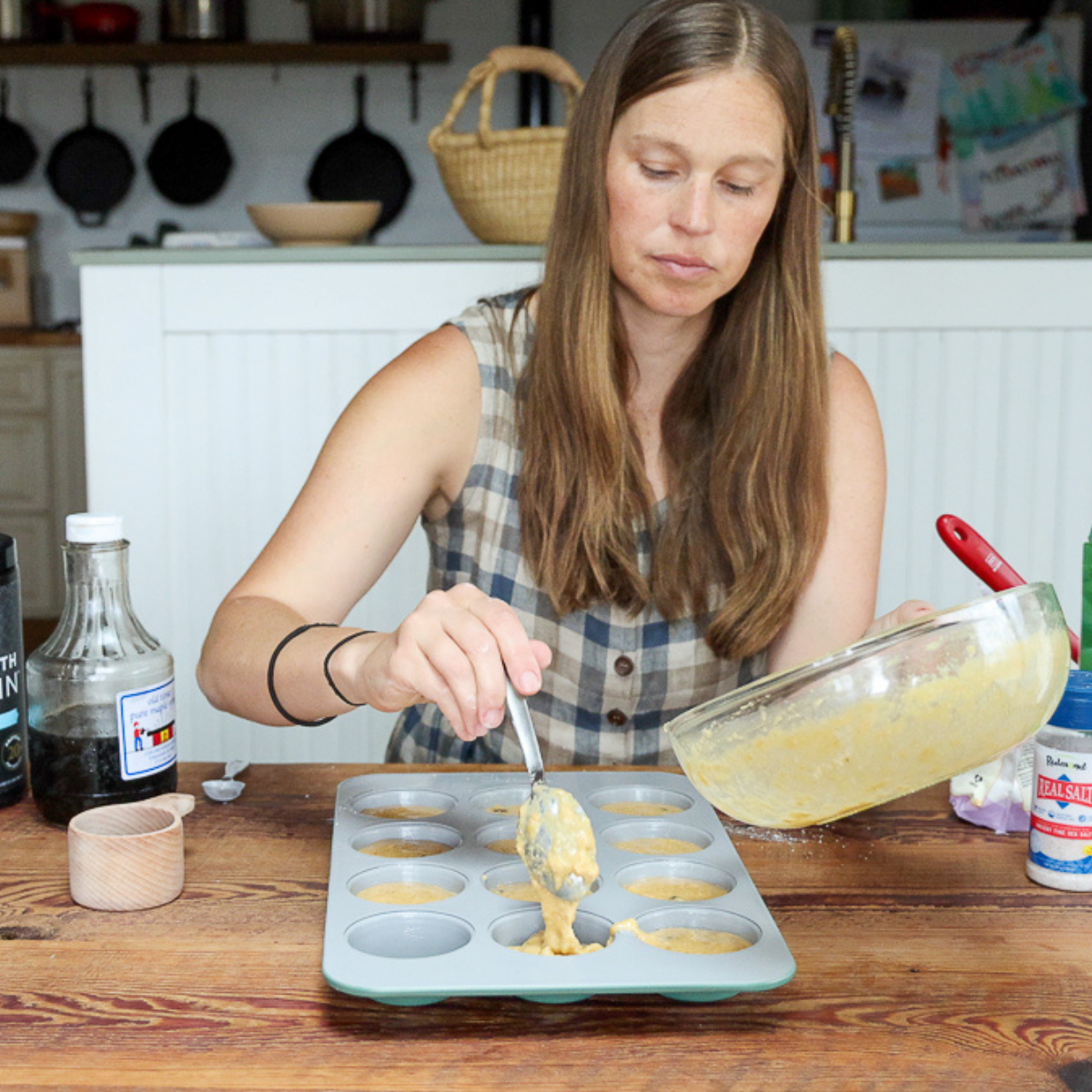 spooning batter for banana protein muffins